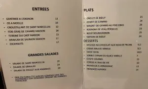 Menu du restaurant avec des plats comme le confit de canard et le bœuf bourguignon. Un vrai virage parisien pour les gourmands.