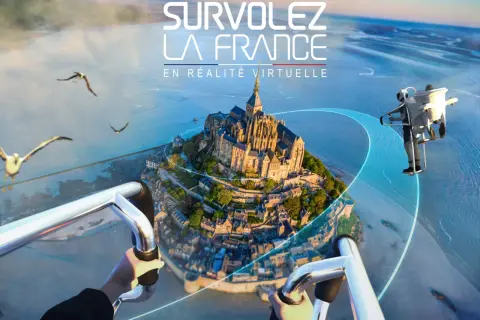Vue aérienne du Mont-Saint-Michel en réalité virtuelle. Un avis FlyView pour une expérience immersive inoubliable.