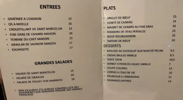 Menu du restaurant avec des plats comme le confit de canard et le bœuf bourguignon. Un vrai virage parisien pour les gourmands.